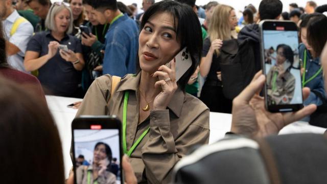 An attendee makes a video with the new iPhone 16 Pro as Apple holds an event at the Steve Jobs Theater on its campus in Cupertino, California, U.S. September 9, 2024